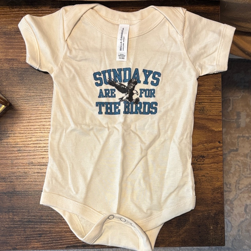 Cream Baby Onesie with Blue Print